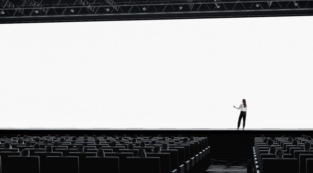 Shows empty event room but active screen